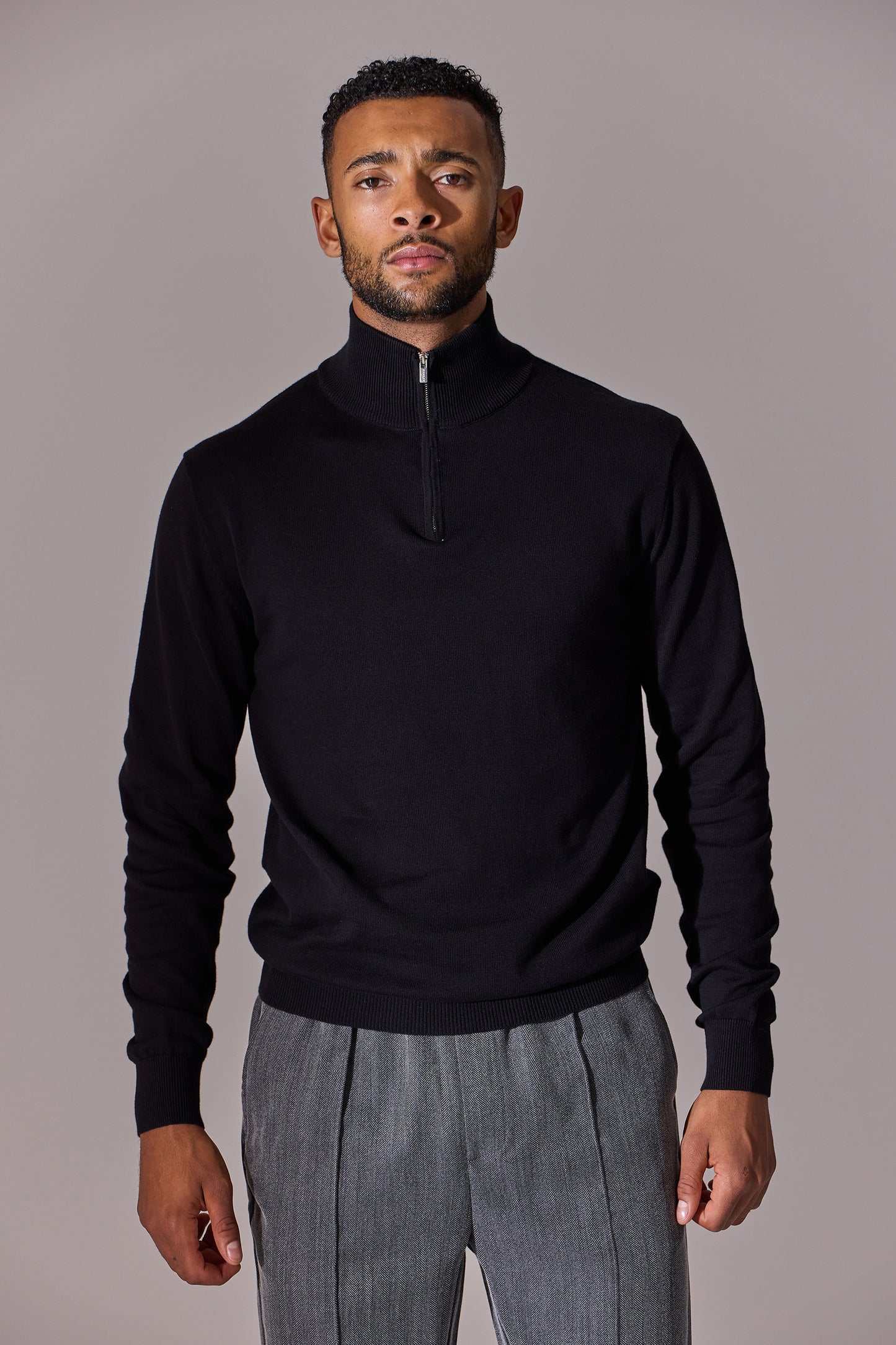Black long sleeve with zip collar polo shirt for men. Maklin Clothing.