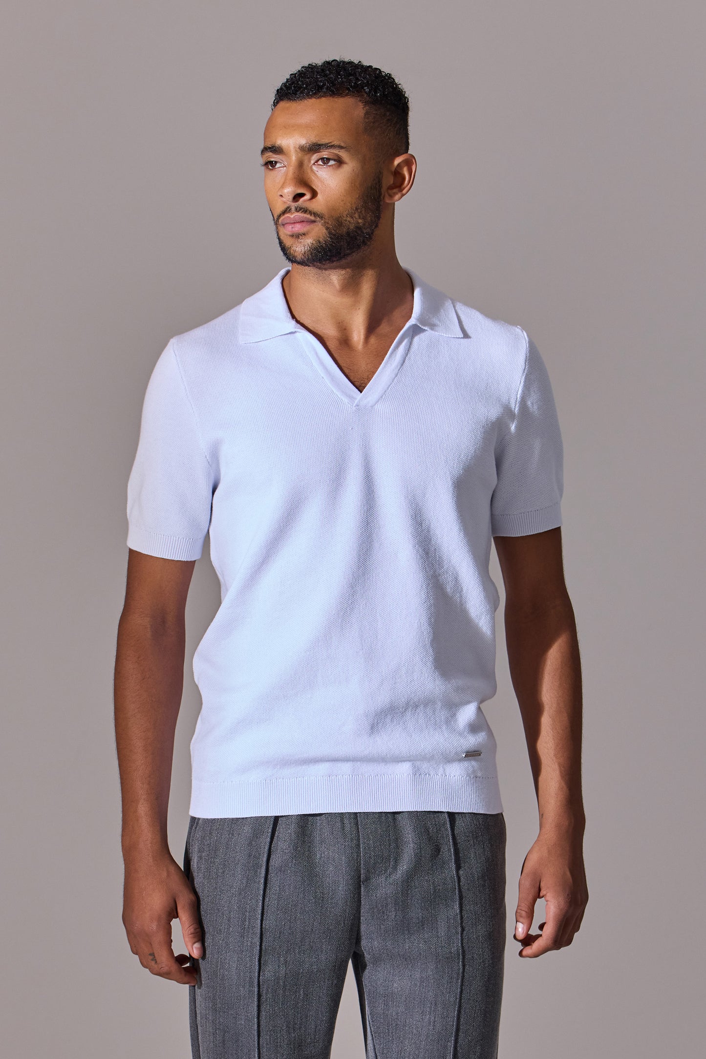 Maklin Clothing's white short sleeve, open collar polo shirt for men.
