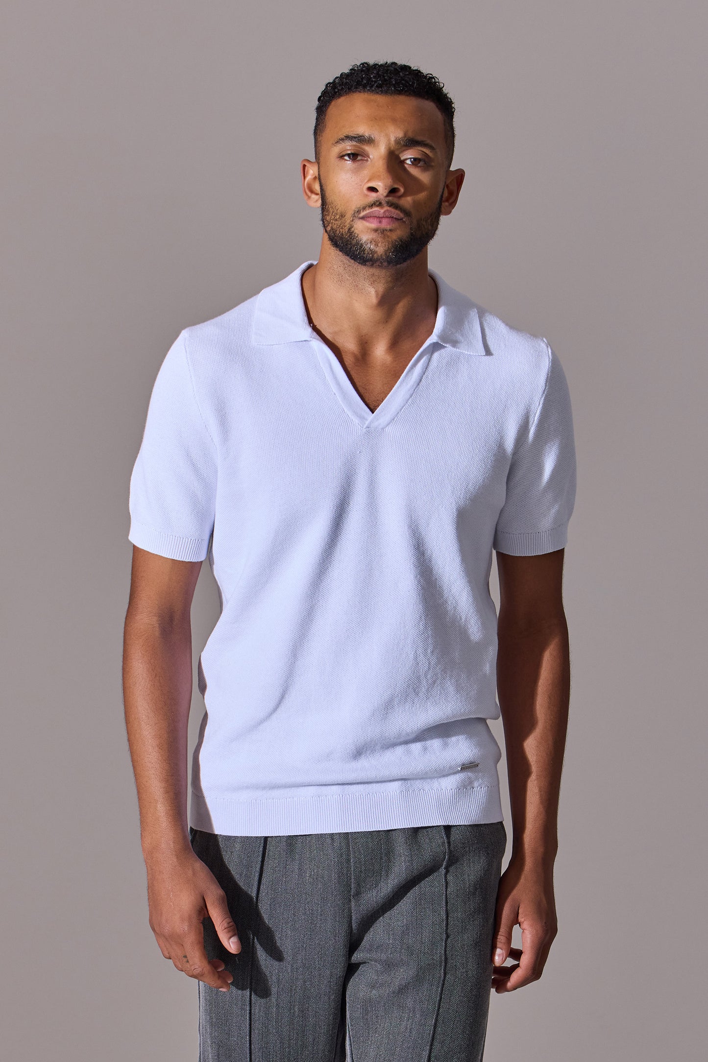 Open collar polo shirt for men in white with short sleeves. Maklin Clothing