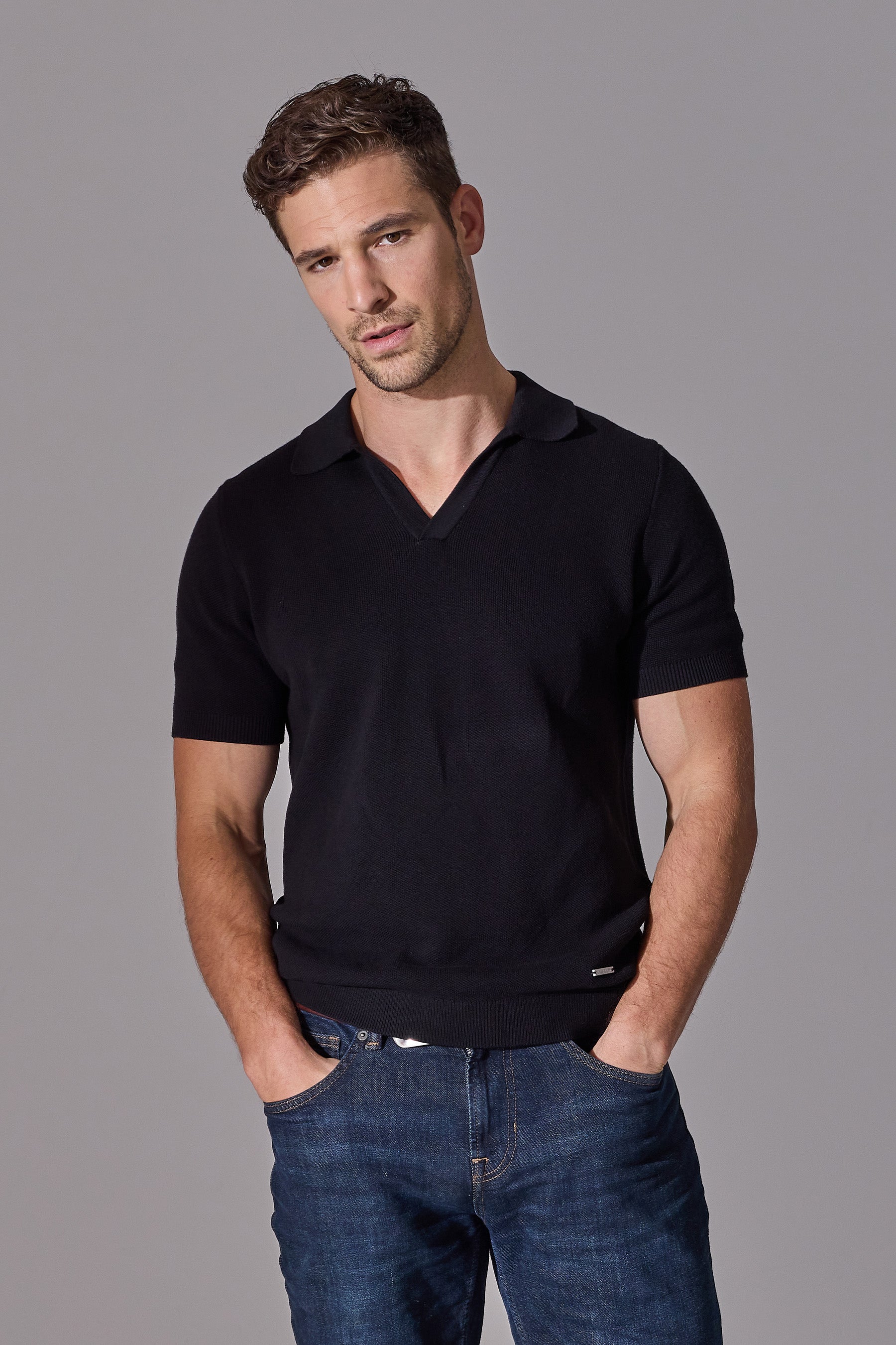 Maklin Clothing's black short sleeve polo shirts for men with open collar.